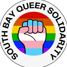 The South Bay Queer Solidarity logo. The group name runs in a circle around an icon of a raised fist in trans colors on a rainbow background.